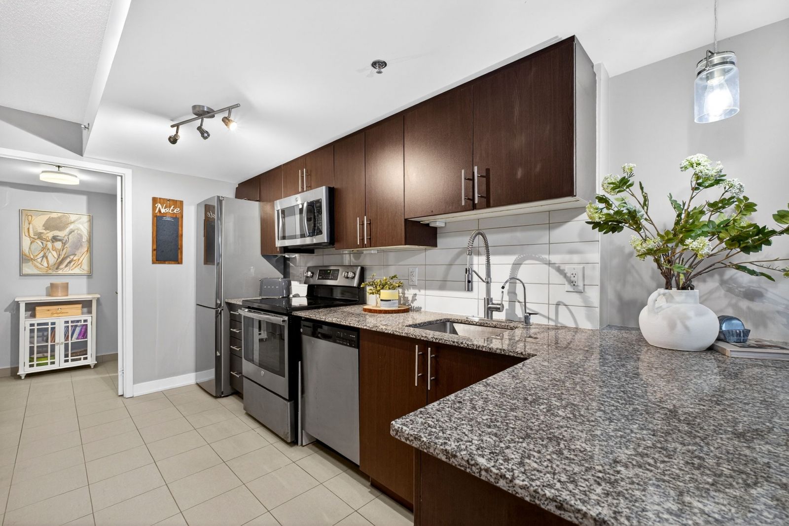 Bright open-concept kitchen and living room in Mimico waterfront townhouse
