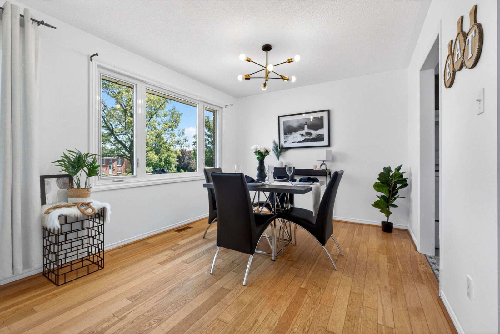 After staging photo of a Peterborough home showing how furniture placement, decor, and lighting improved the space for buyers.